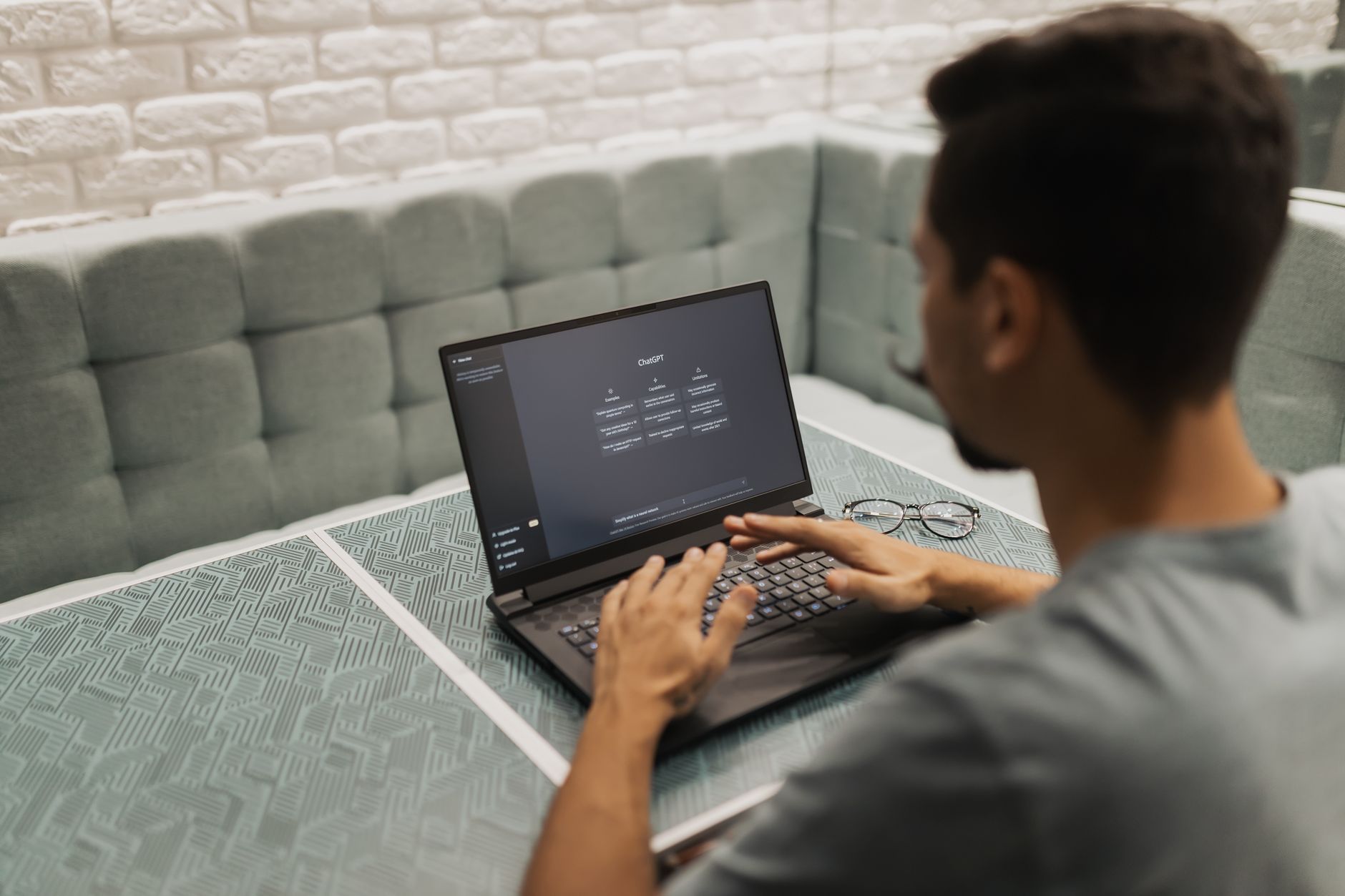 Person building an automated workflow on a computer screen with connected nodes