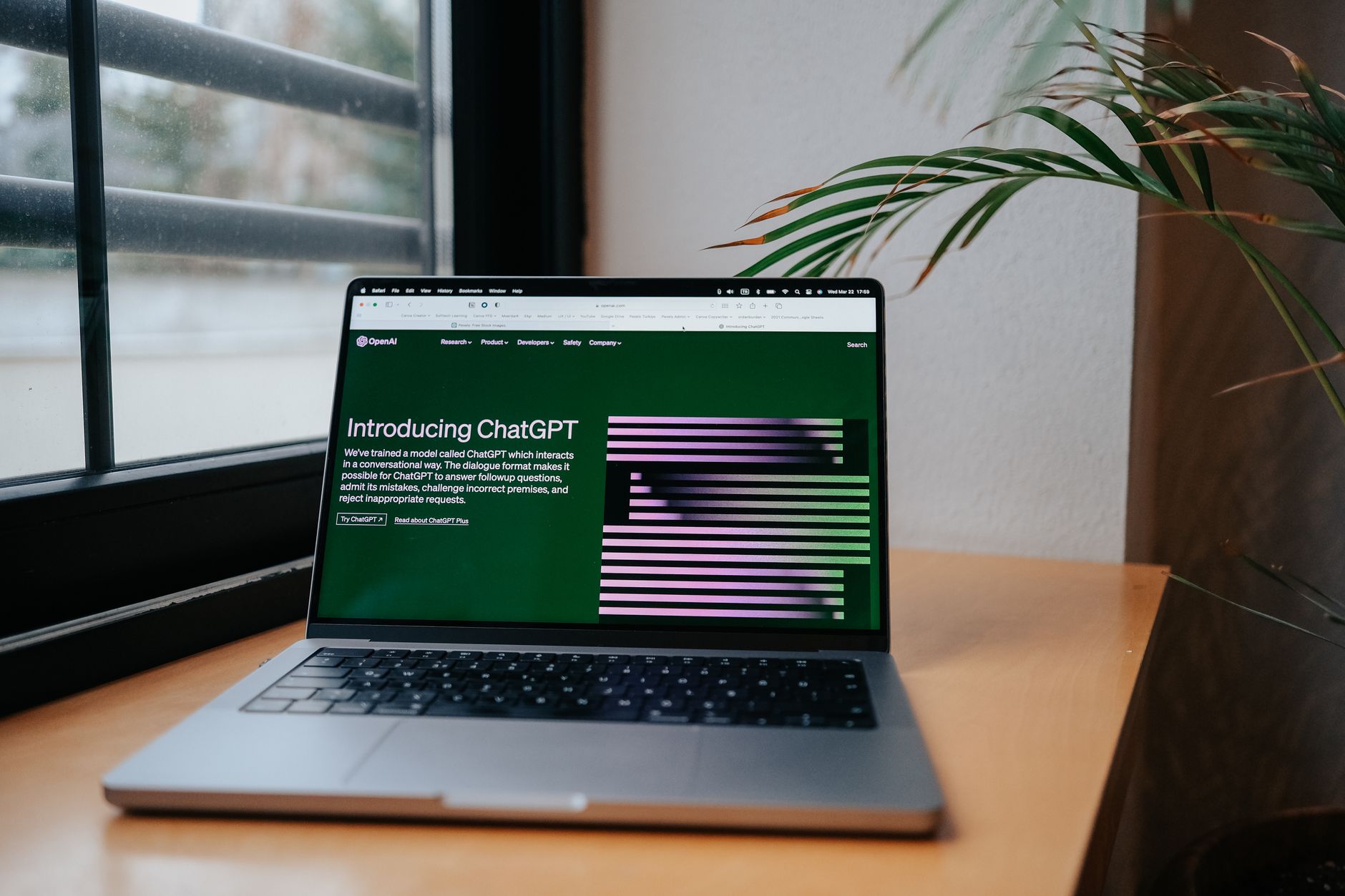 Two marketers reviewing AI-generated copy on a laptop with brand guidelines nearby.