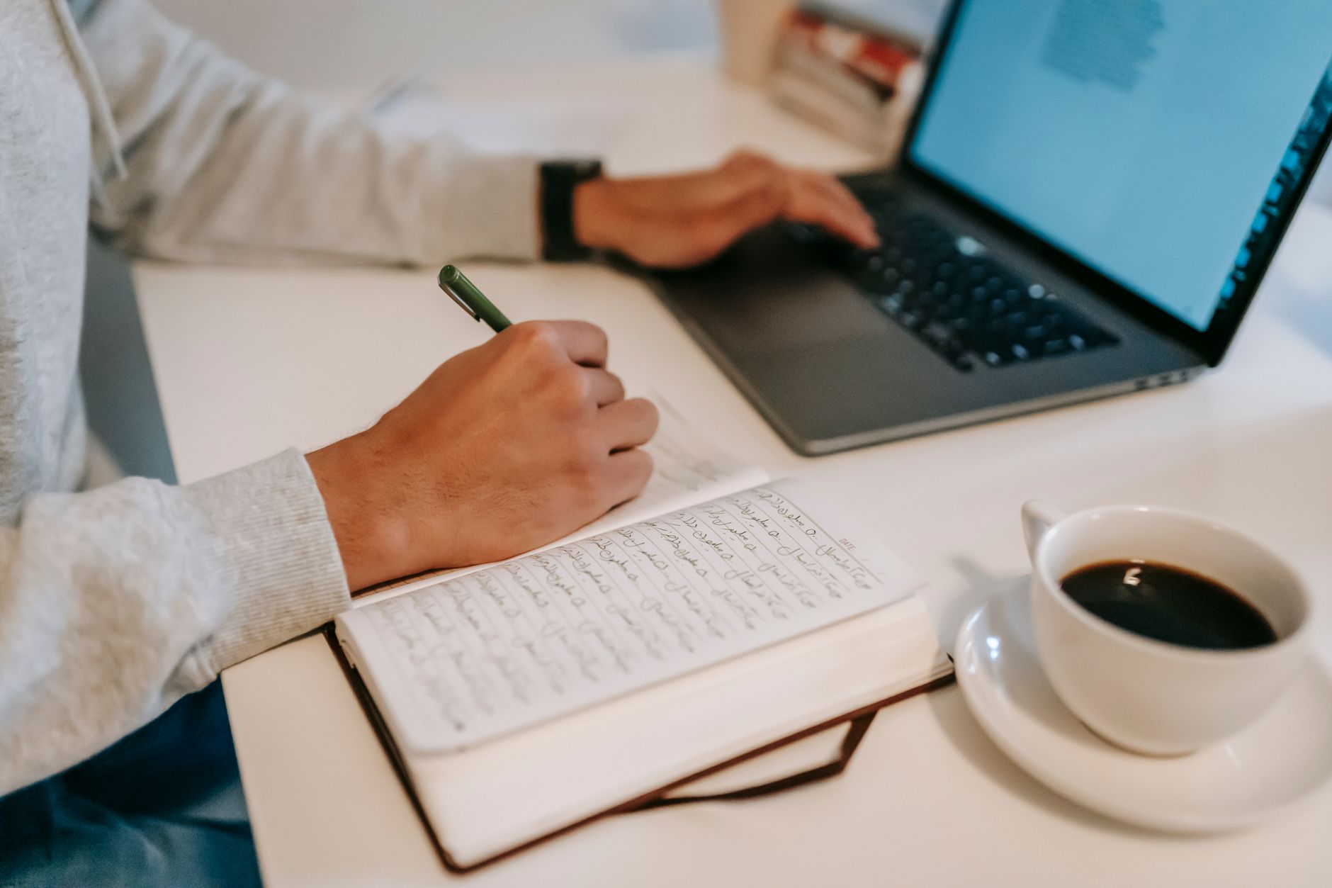 Writer reviewing a long document on a large ultrawide monitor