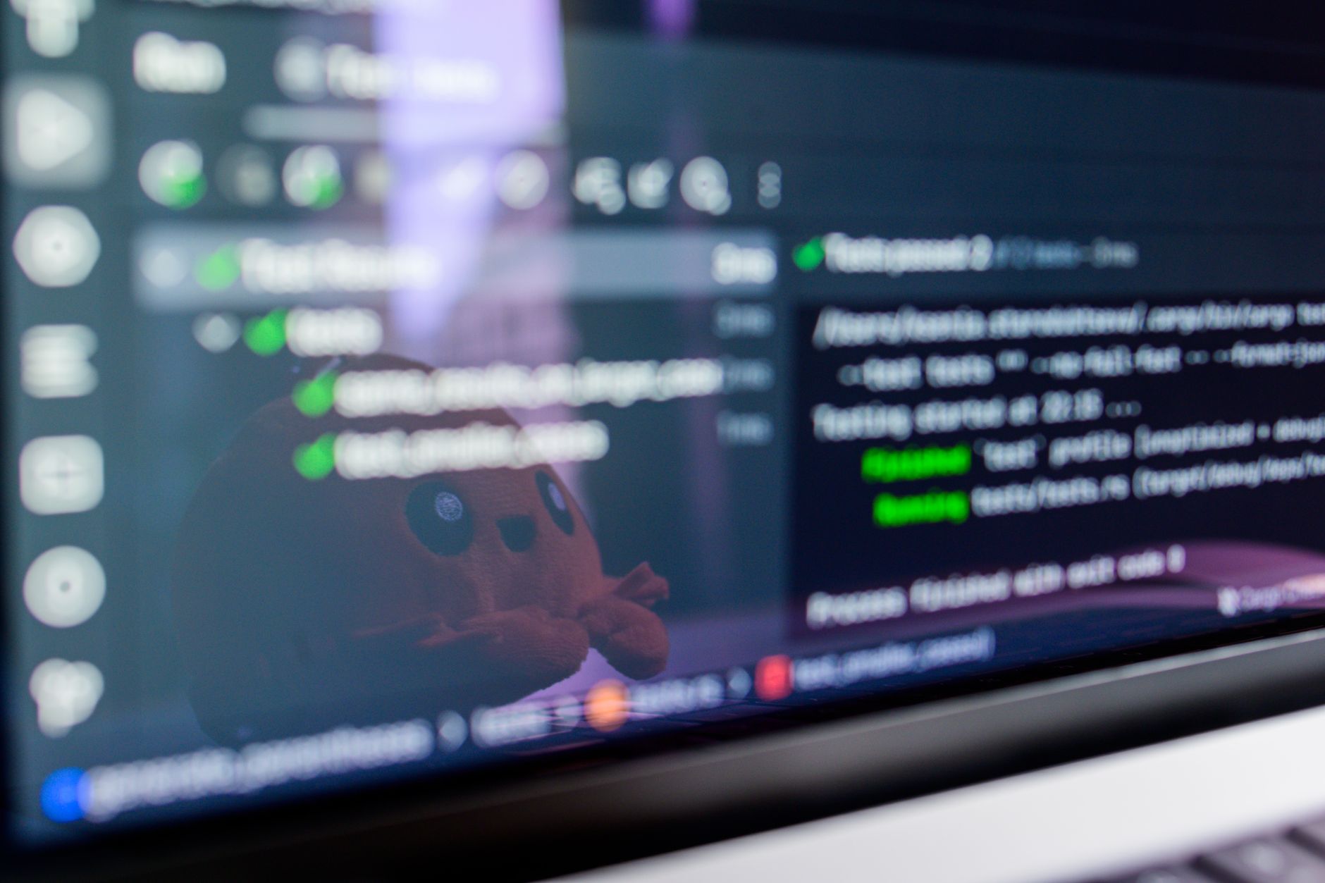Programmer using a split screen code editor with an AI chat panel open